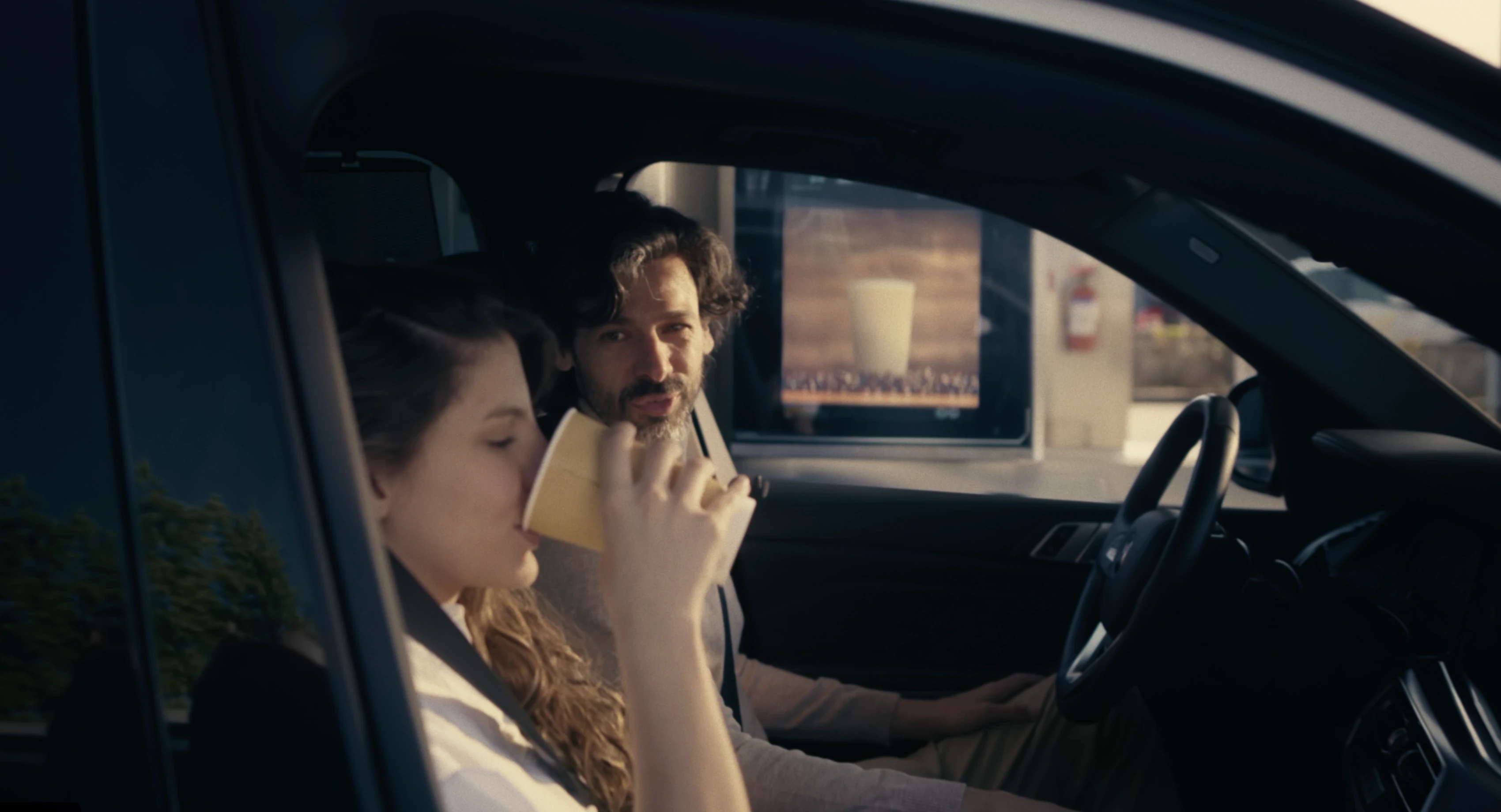 Couple in car at fuel station, the consumer moment the FM27 captures