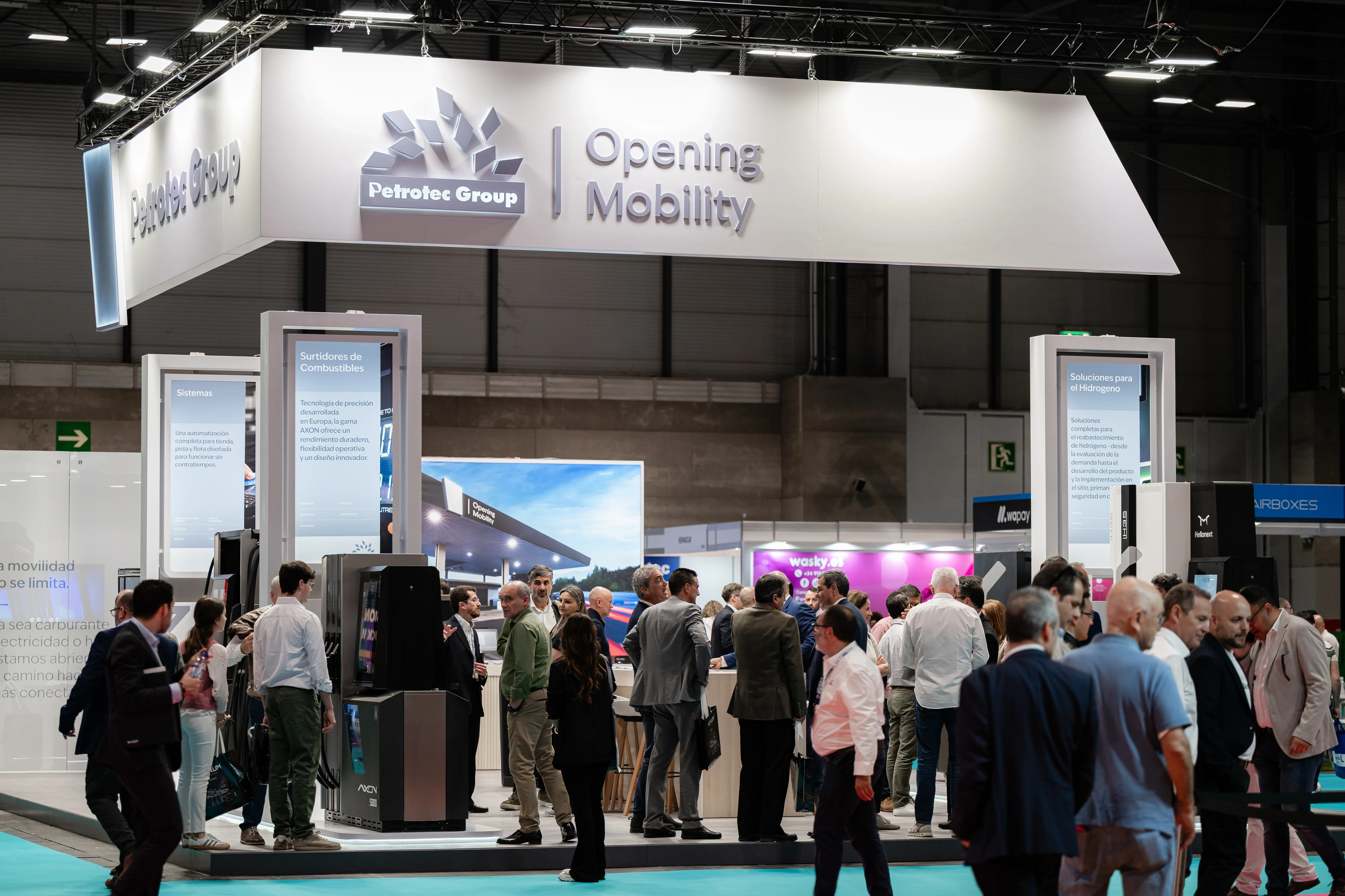 Petrotec Group Opening Mobility stand at Motortec: crowd engaging with product displays