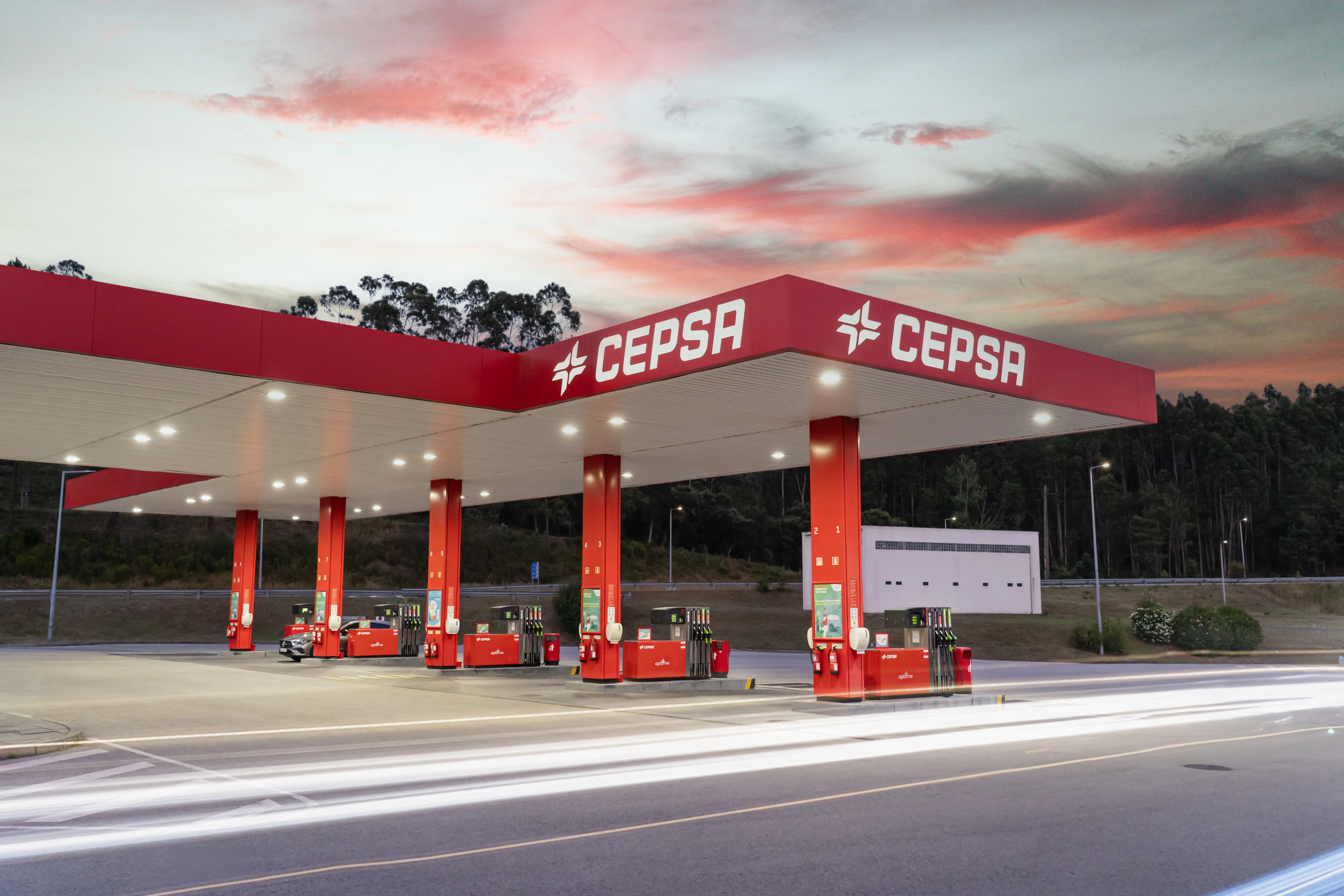 CEPSA station at sunset: long exposure light trails across forecourt