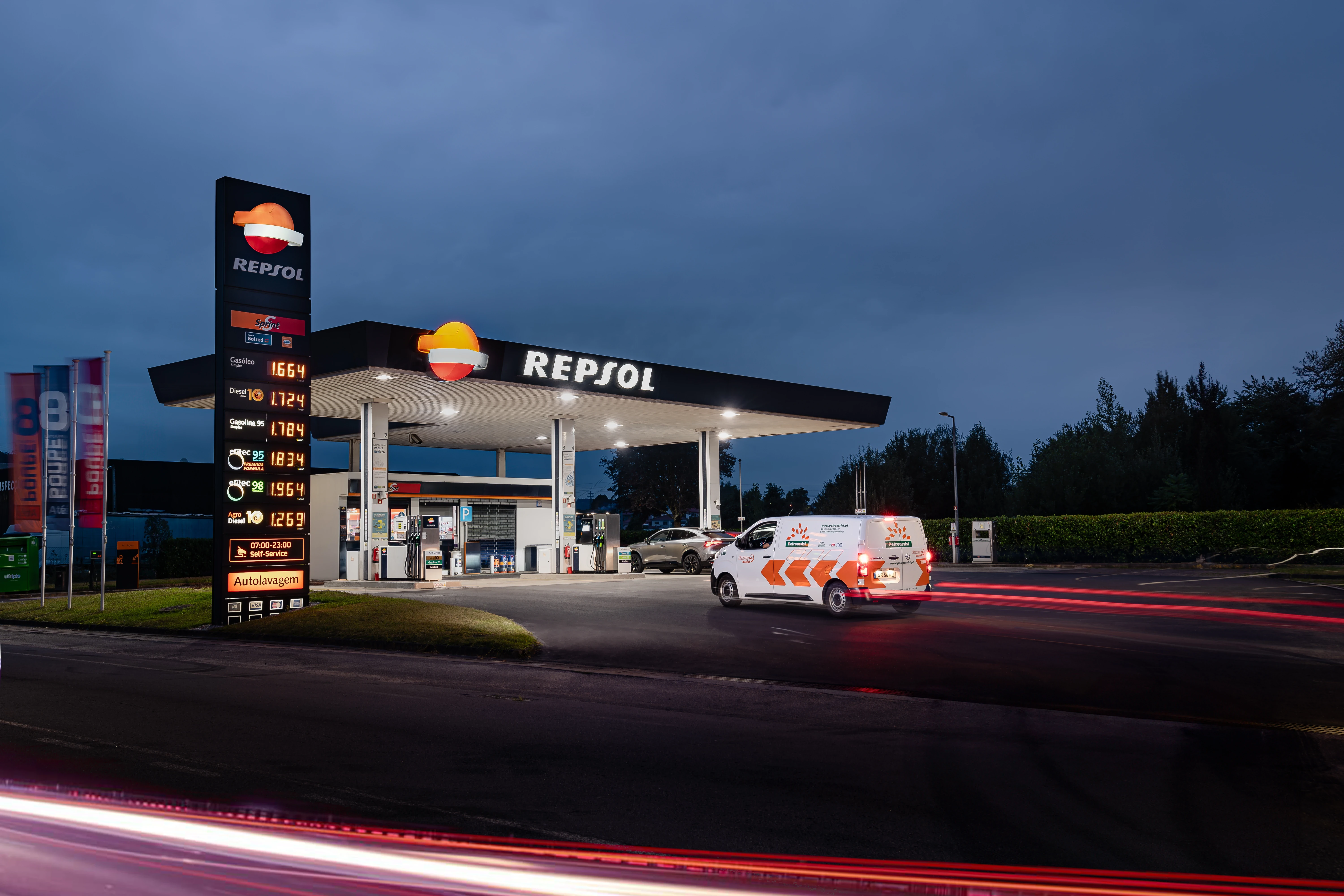 Repsol station at night: Petroassist service van on site