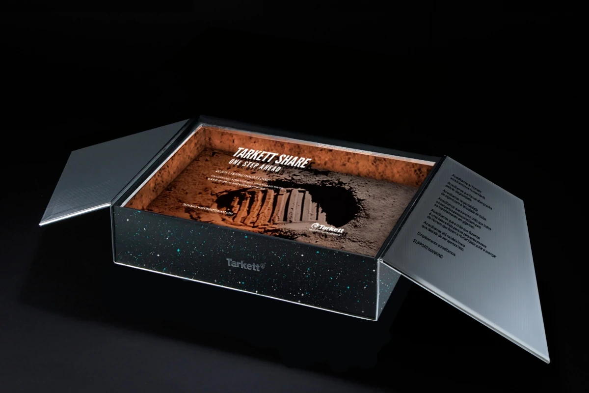 Tarkett Share open invitation box: moon footprint with One Step Ahead event details